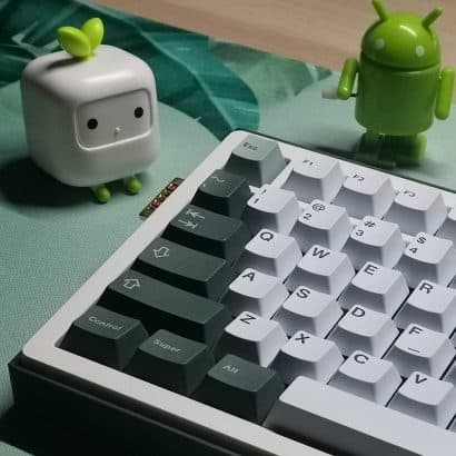 a computer keyboard sitting on top of a table
